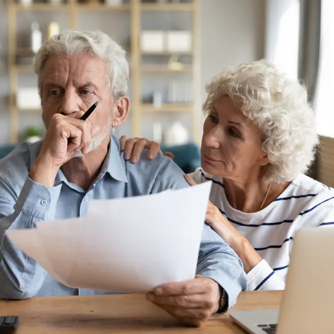 Man an a woman fretting over solar contract